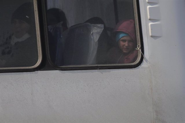 Civilians leave Mariupol on a bus